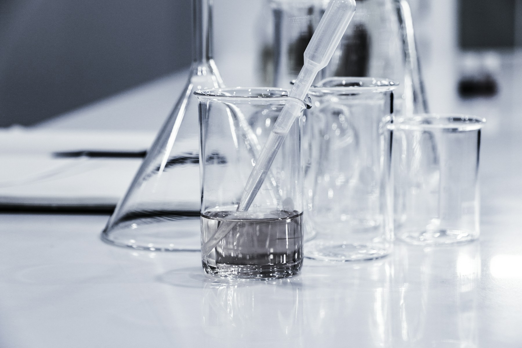 Glass laboratory vessels in a bright research environment